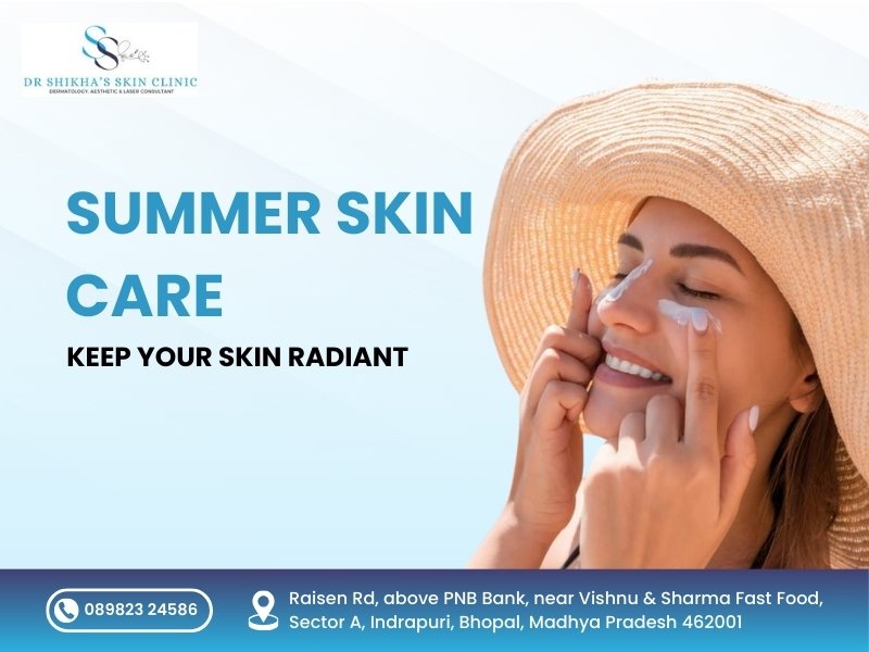 A woman wearing a sun hat applies sunscreen to her face. Text promotes "SUMMER SKIN CARE: KEEP YOUR SKIN RADIANT" at Dr Shikha's Skin Clinic in Bhopal, with contact number and address.