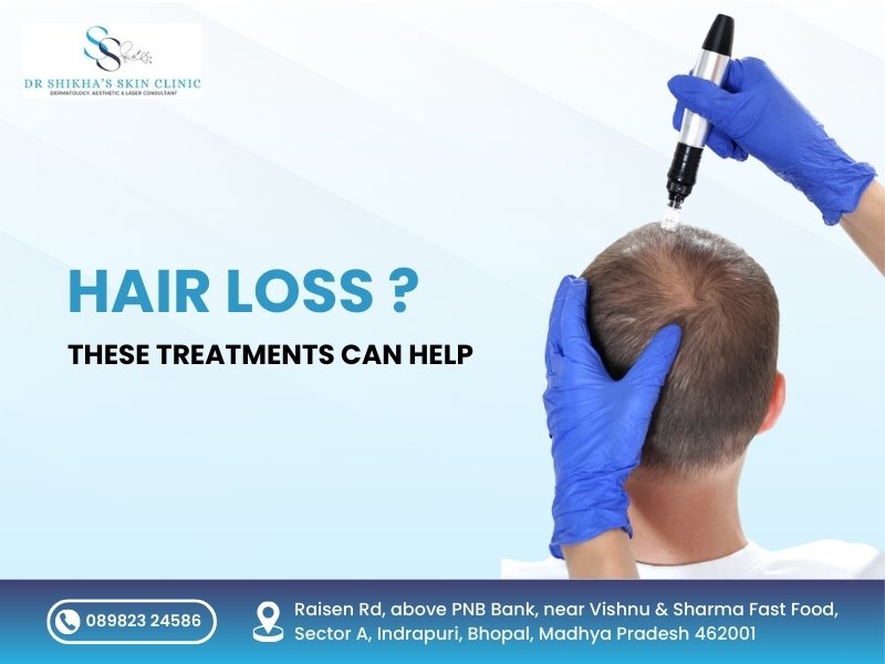 Hands in blue gloves apply a treatment to a man's scalp with thinning hair. Text asks "HAIR LOSS ?" and states "THESE TREATMENTS CAN HELP" at Dr Shikha's Skin Clinic in Bhopal, with contact number and address.